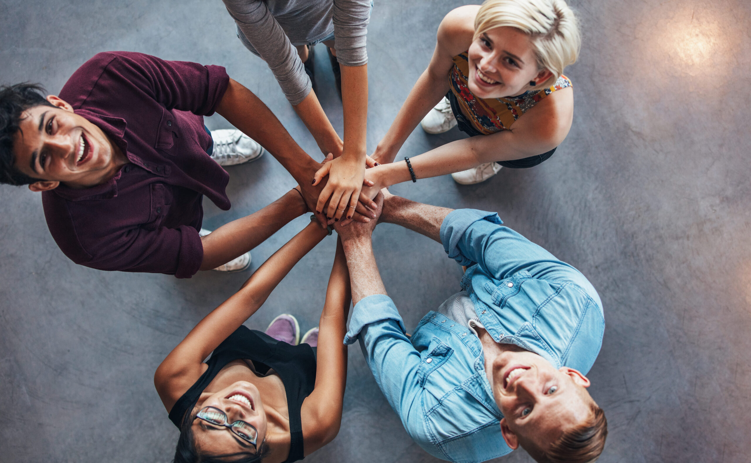 Diverse team celebrating collaboration and positive workplace culture
